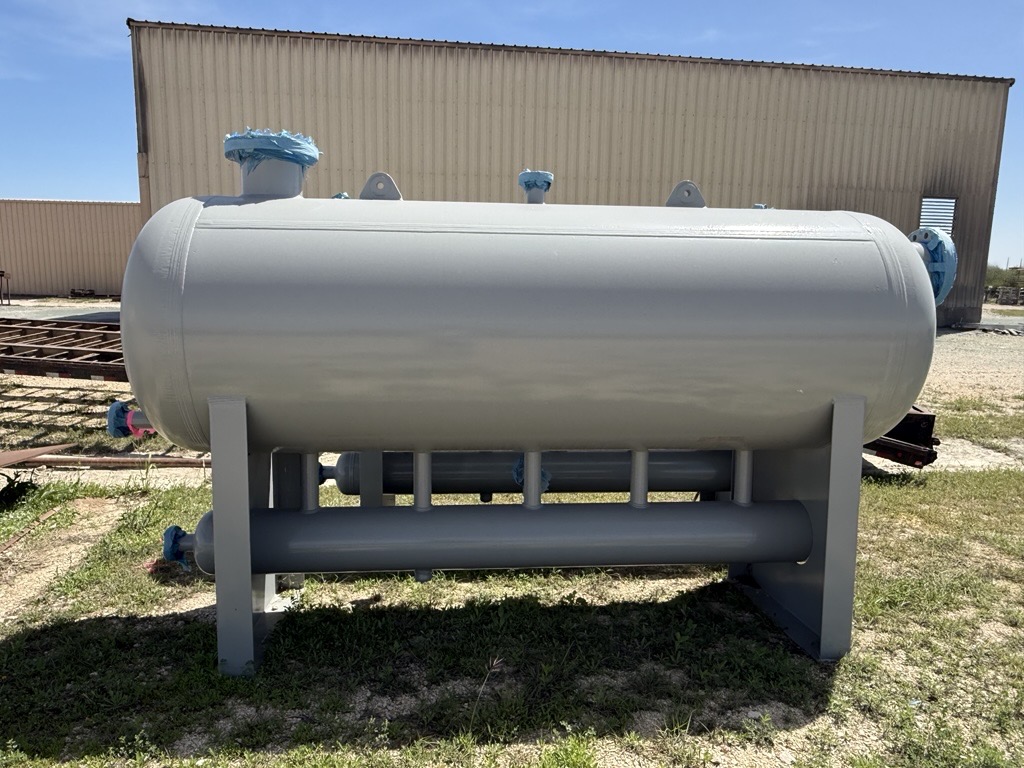 Grey horizontal separator with underside piping manifold