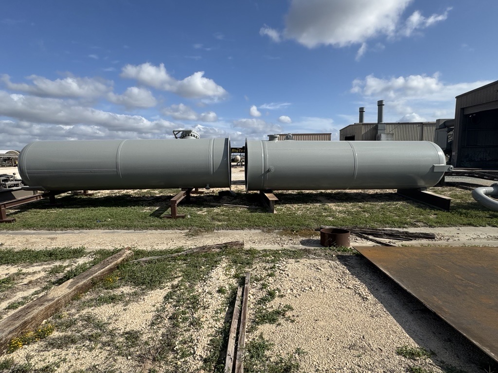 Long grey twin-barrel separator vessel on skids